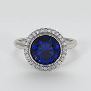 Tanzanite Engagement Ring With Halo Of Diamonds - from £1795