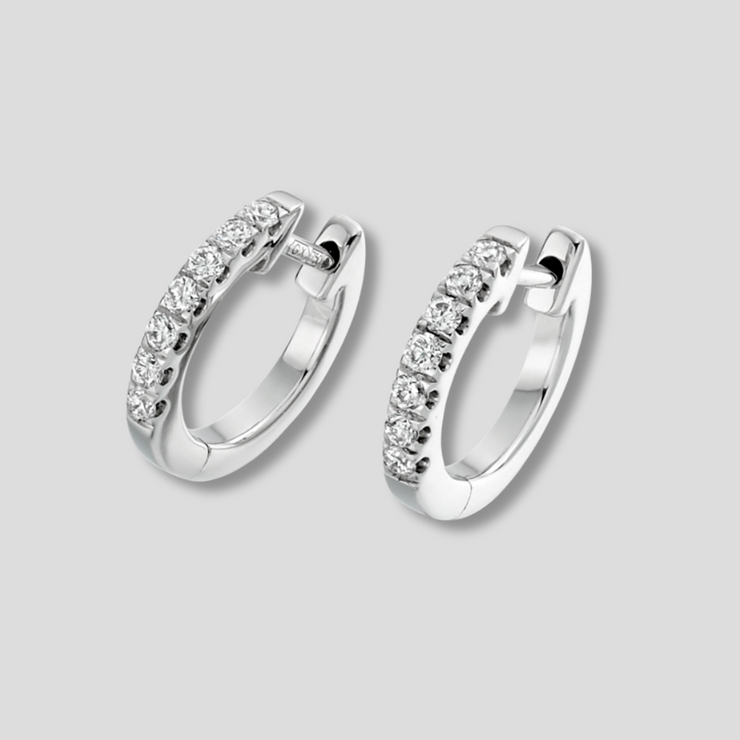 Micro Claw Set Diamond Hoop Earrings In White Gold Totalling 0.25ct. Available from FANCI Fine Jewellery, Southampton, UK.