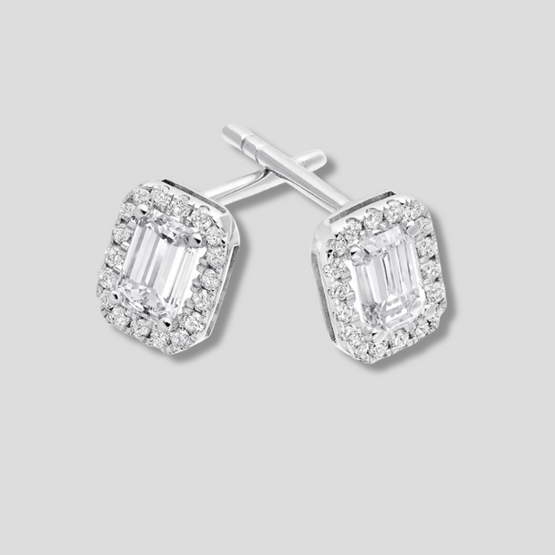 Emerald Cut Diamond With Halo Stud Earrings In White Gold. Available from FANCI Fine Jewellery, Southampton, UK.