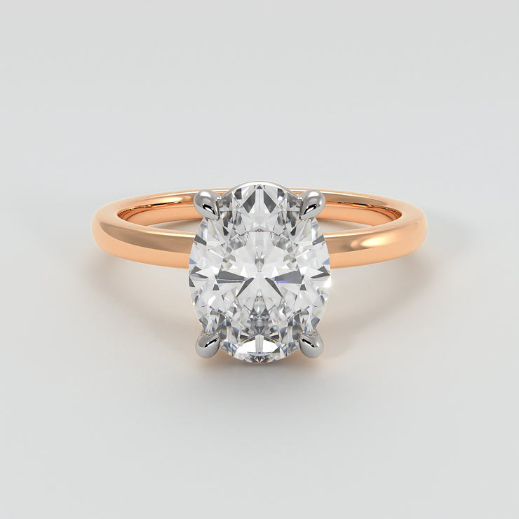 Oval Diamond Engagement Ring Set On Rose Gold Band. Designed And Manufactured By FANCI Fine Jewellery, Southampton, UK.