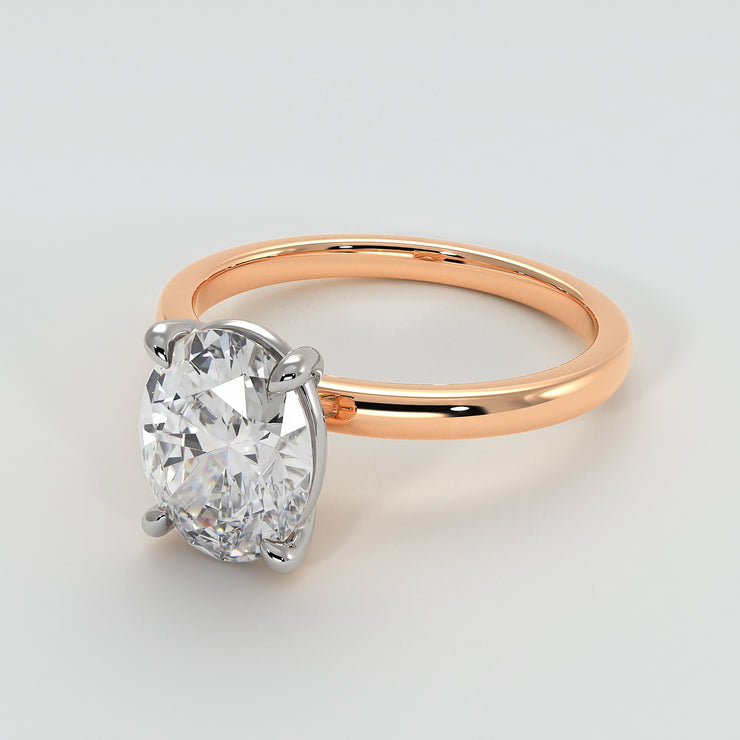 Oval Diamond Engagement Ring Set On Rose Gold Band. Designed And Manufactured By FANCI Fine Jewellery, Southampton, UK.