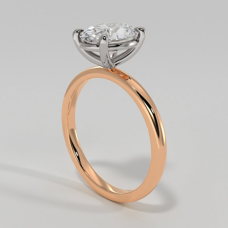 Oval Diamond Engagement Ring Set On Rose Gold Band. Designed And Manufactured By FANCI Fine Jewellery, Southampton, UK.