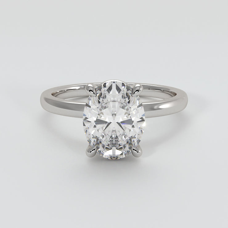 Oval Diamond Engagement Ring Set On White Gold Band. Designed And Manufactured By FANCI Fine Jewellery, Southampton, UK.