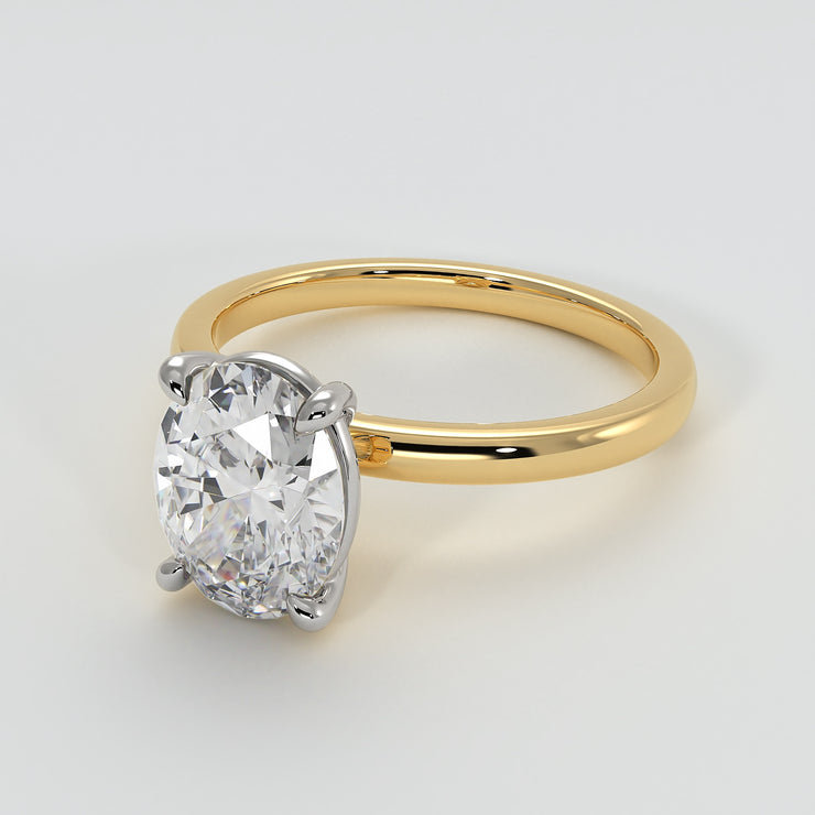 Oval Diamond Engagement Ring Set On Yellow Gold Band. Designed And Manufactured By FANCI Fine Jewellery, Southampton, UK.