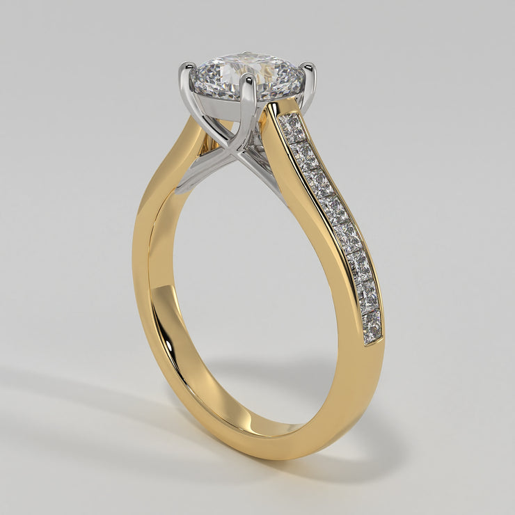 Cushion Cut Diamond Engagement Ring Set In Yellow Gold With Princess Cut Diamond Shoulders In A Channel Setting Designed And Manufactured By FANCI Bespoke Fine Jewellery