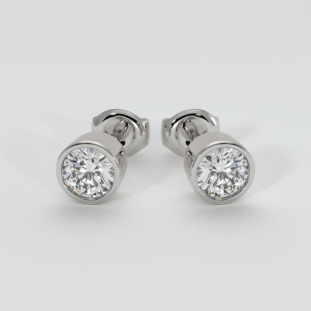 Diamond Stud Earrings In Rub Over Setting In White Gold Designed by FANCI Bespoke Fine Jewellery