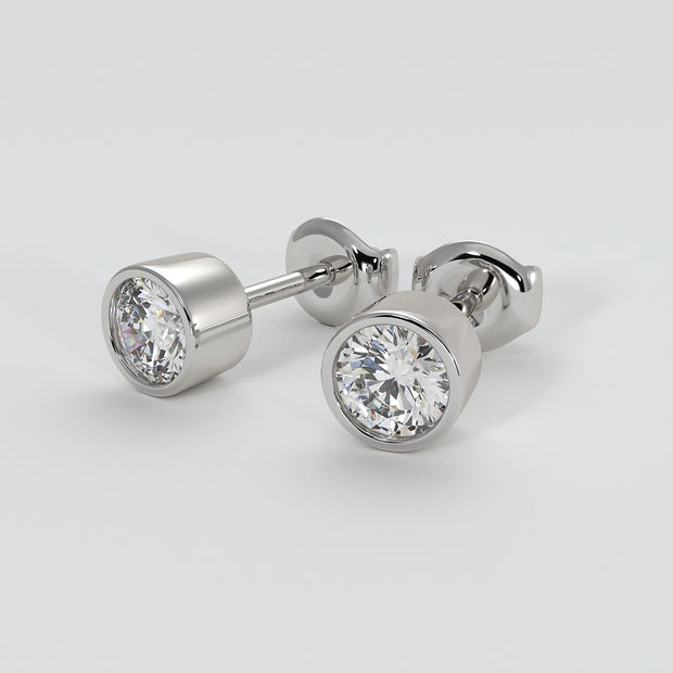 Diamond Stud Earrings In Rub Over Setting In White Gold Designed by FANCI Bespoke Fine Jewellery