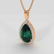 Ornate Emerald Pear Pendant With Diamond Halo