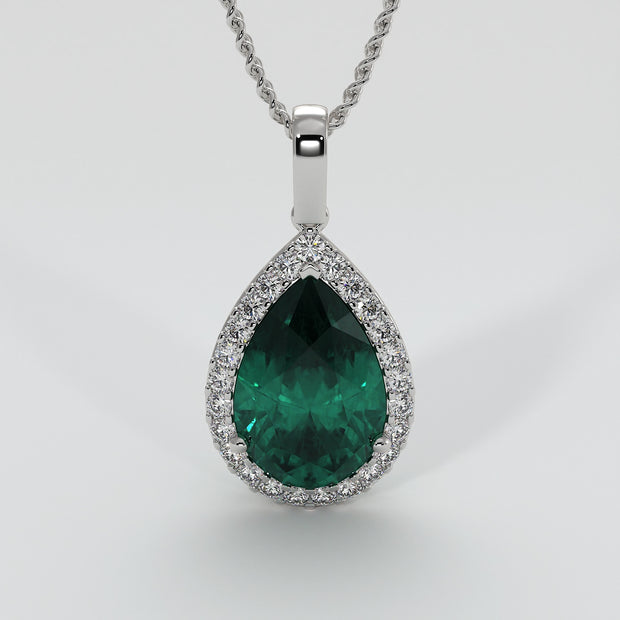 Large Pear Shape Emerald With A Diamond Halo Set In White Gold Designed And Manufactured By FANCI Bespoke Fine Jewellery