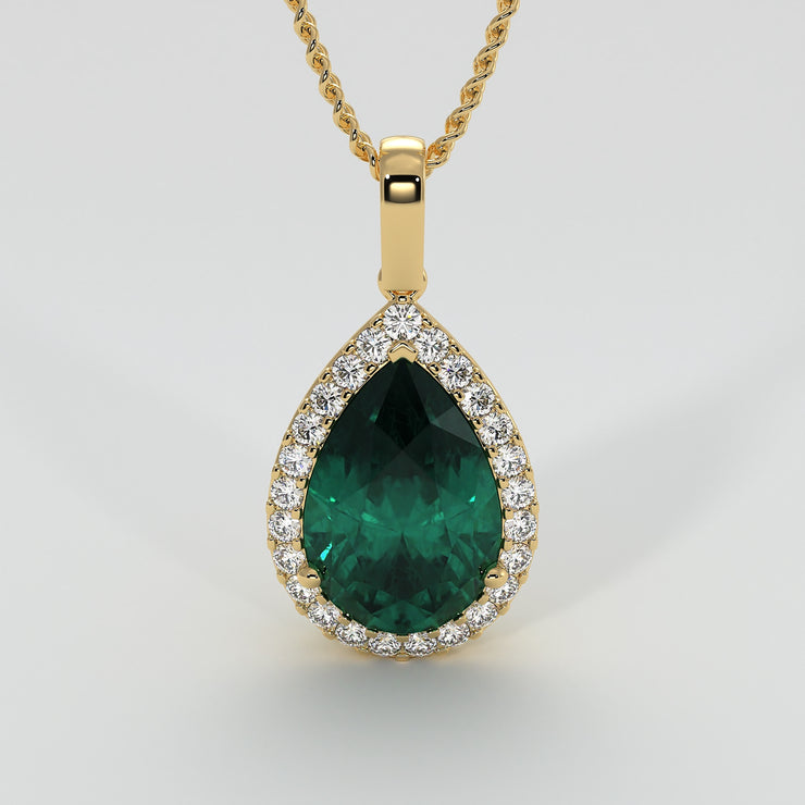Large Pear Shape Emerald With A Diamond Halo Set In Yellow Gold Designed And Manufactured By FANCI Bespoke Fine Jewellery