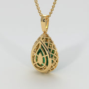 Large Pear Shape Emerald With A Diamond Halo Set In Yellow Gold Designed And Manufactured By FANCI Bespoke Fine Jewellery