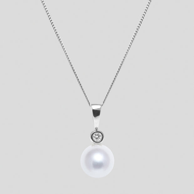 White 8-8.5mm cultured river pearl and diamond pendant set in 18ct white gold with an 18ct white gold trace chain by FANCI bespoke fine jewellery