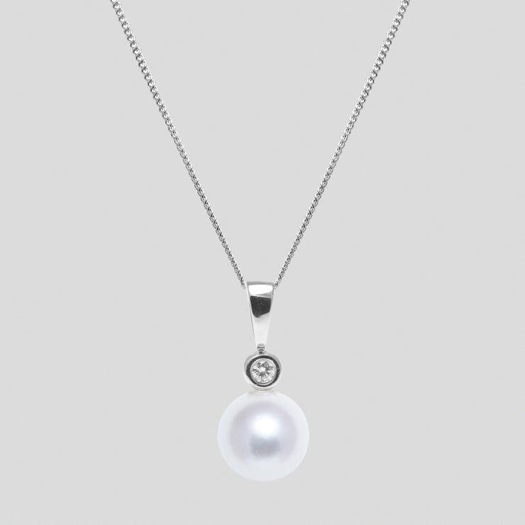 White 8-8.5mm cultured river pearl and diamond pendant set in 18ct white gold with an 18ct white gold trace chain by FANCI bespoke fine jewellery