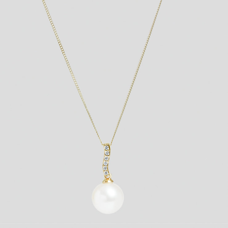 White 10-10.5mm cultured river pearl and diamond pendant set in 18ct yellow gold with an 18ct yellow gold diamond cut trace chain by FANCI bespoke fine jewellery