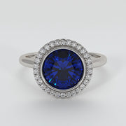 Tanzanite Engagement Ring With Halo Of Diamonds In White Gold Designed by FANCI Bespoke Fine Jewellery