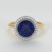 Tanzanite Engagement Ring With Halo Of Diamonds In Yellow Gold Designed by FANCI Bespoke Fine Jewellery